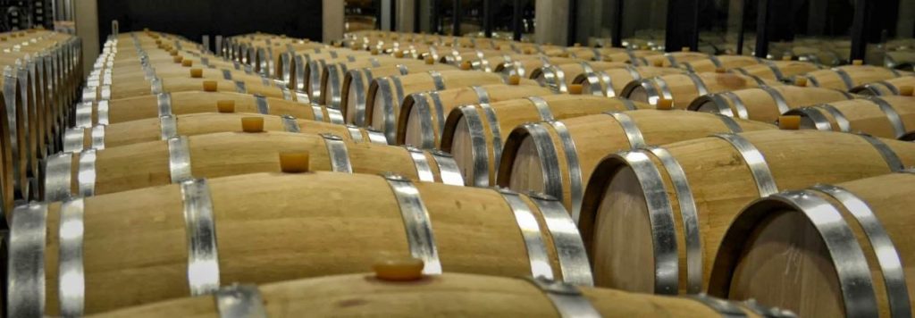 Rows of oak barrels filling the cellar where Ribera wine matures 